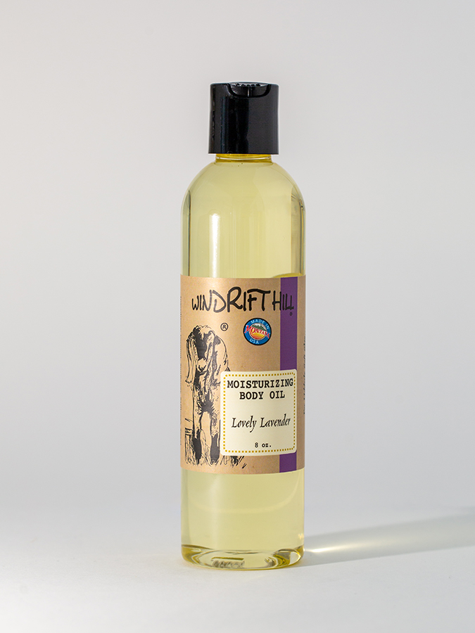 Bottle of Lovely Lavender Body Oil with lavender flowers for moisturizing and relaxation