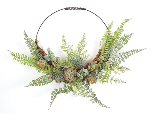 Fern and succulent moss half wreath wall decor with realistic foliage and variegated succulents on wire and grapevine base.