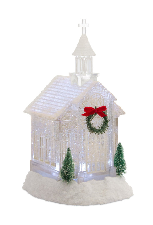 LED church snow globe with pine accents and glowing LED lights on snowy base